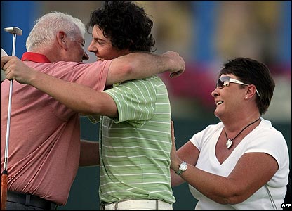 Golfer hugging parents after win