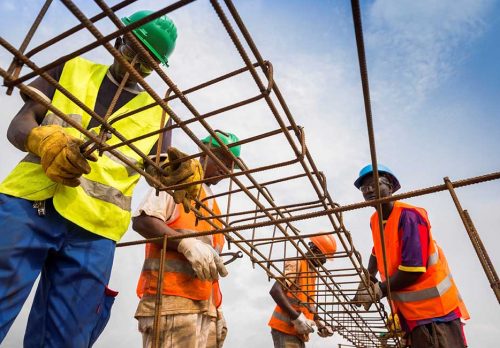 Construction workers working with steel
